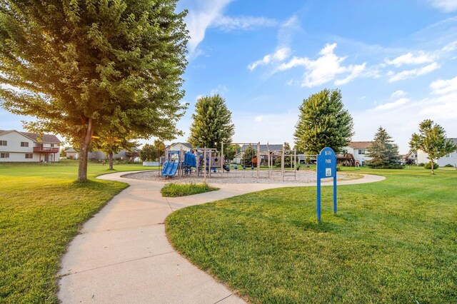 view of property's community featuring a playground and a yard