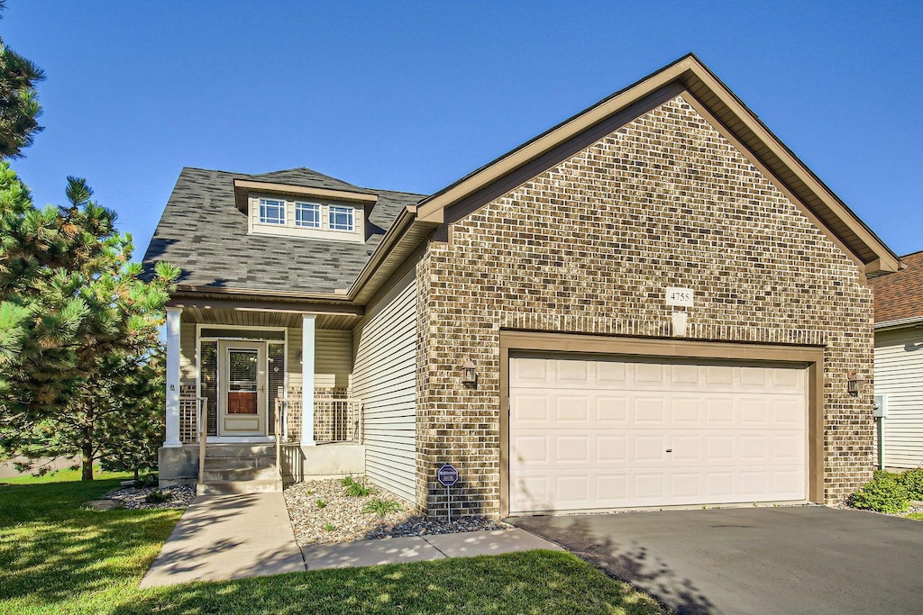 view of front facade with a front lawn and a garage