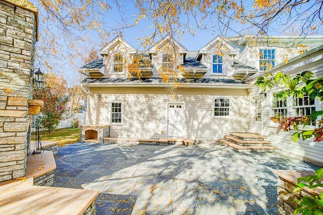 back of house featuring a patio area