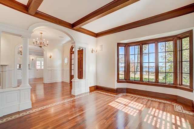 interior space featuring plenty of natural light, light hardwood / wood-style floors, and beam ceiling