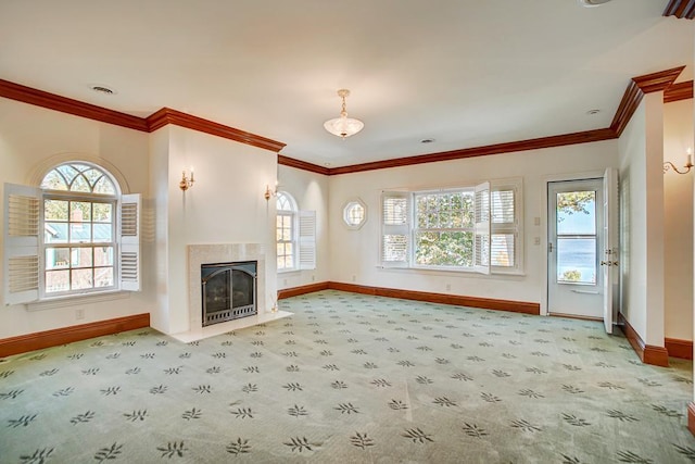 unfurnished living room featuring carpet, plenty of natural light, and crown molding