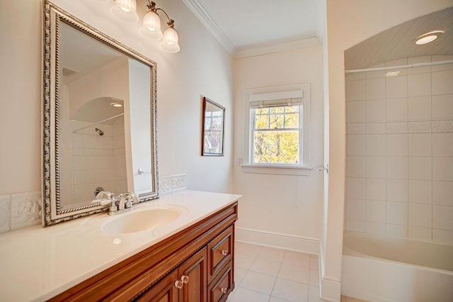 bathroom featuring vanity, tile patterned floors, tiled shower / bath combo, and crown molding