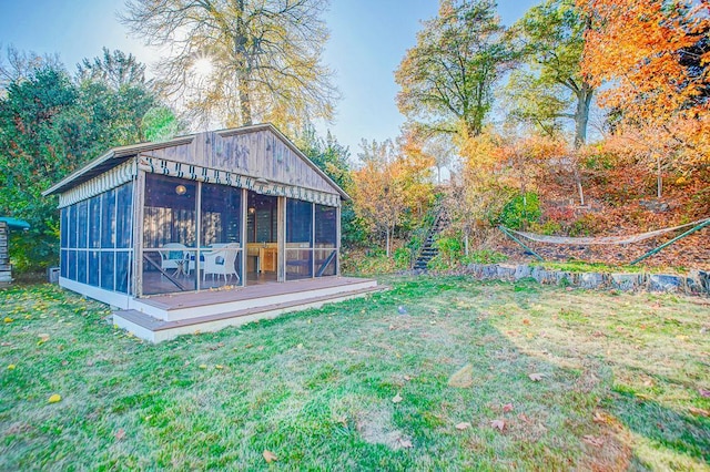 view of yard featuring a sunroom