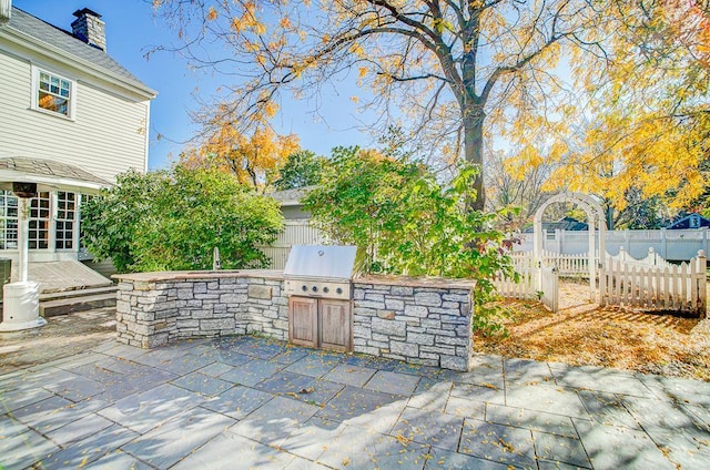 view of patio / terrace with area for grilling and sink