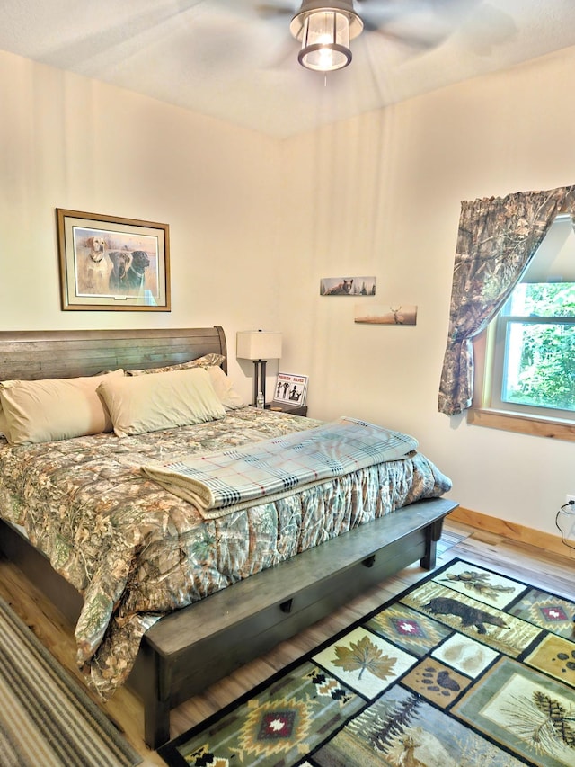 bedroom featuring ceiling fan and hardwood / wood-style floors