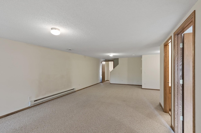 empty room with a textured ceiling and a baseboard radiator