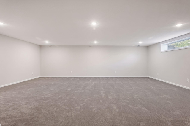 basement with dark colored carpet