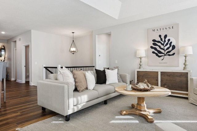 living room with dark hardwood / wood-style flooring