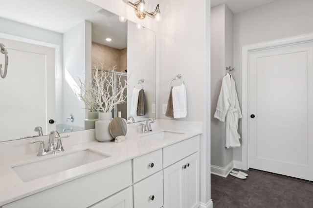 bathroom with a shower and vanity