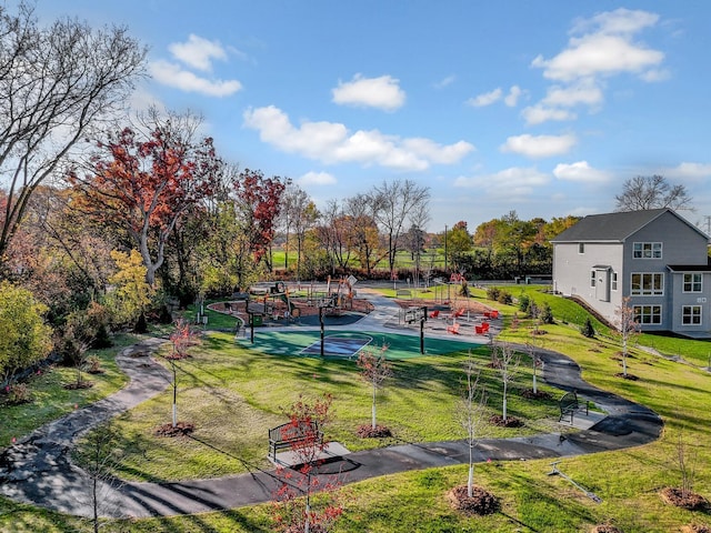 view of property's community with a lawn