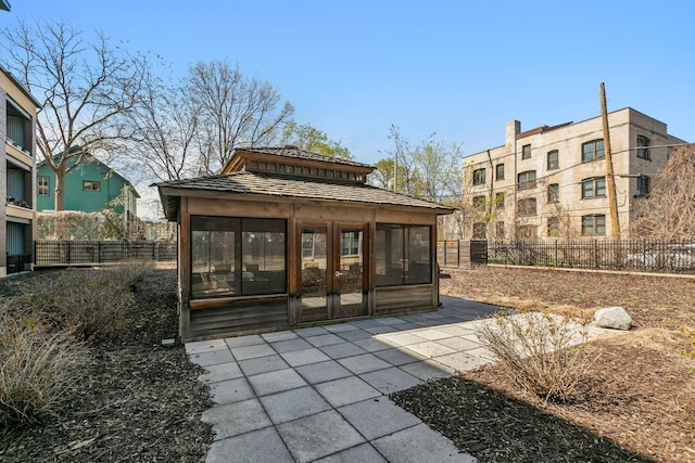 exterior space featuring a sunroom and a patio area