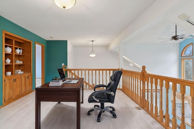 office space with vaulted ceiling with beams, ceiling fan, and built in features