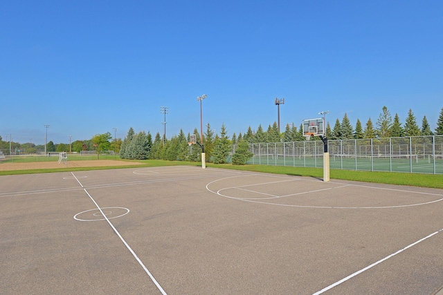 view of sport court featuring community basketball court and fence