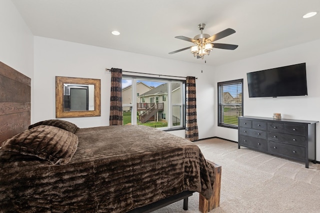 bedroom with recessed lighting, ceiling fan, multiple windows, and light carpet