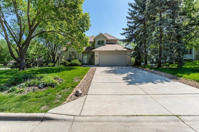 view of property hidden behind natural elements with a front yard and a garage