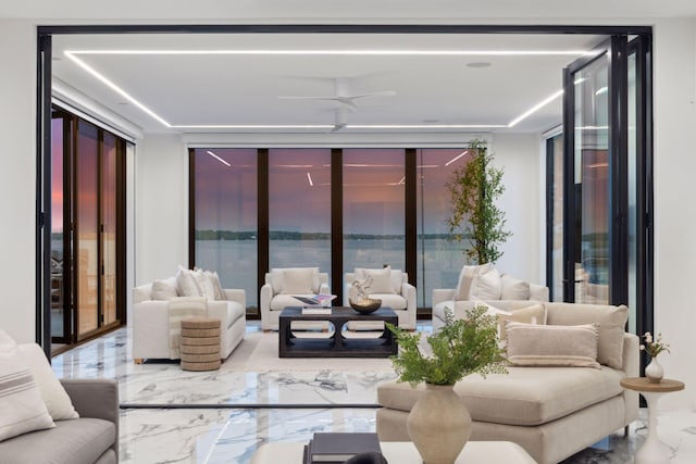 1225 Shoreline Dr, Orono, MN 55391 - living area with marble tiled floors, floor to ceiling windows, healthy amount of natural light, and a water view