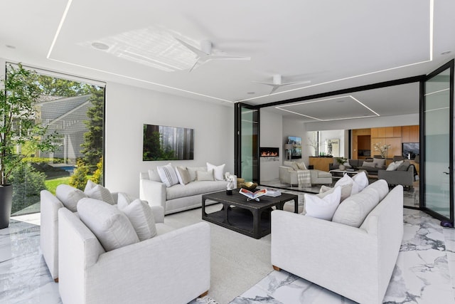 1225 Shoreline Dr, Orono, MN 55391 - living room featuring light marble finish flooring and a ceiling fan