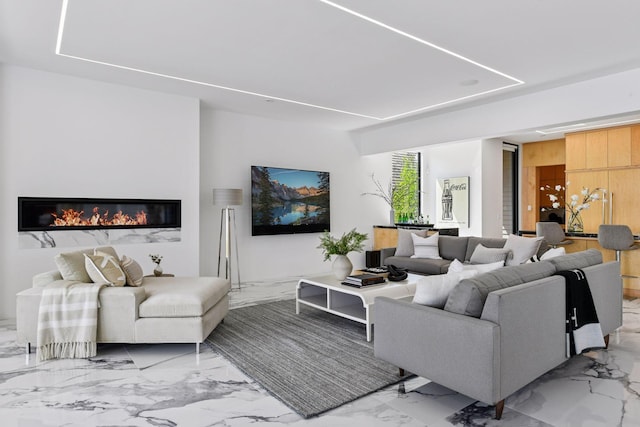 1225 Shoreline Dr, Orono, MN 55391 - living area with light marble finish floors and a glass covered fireplace