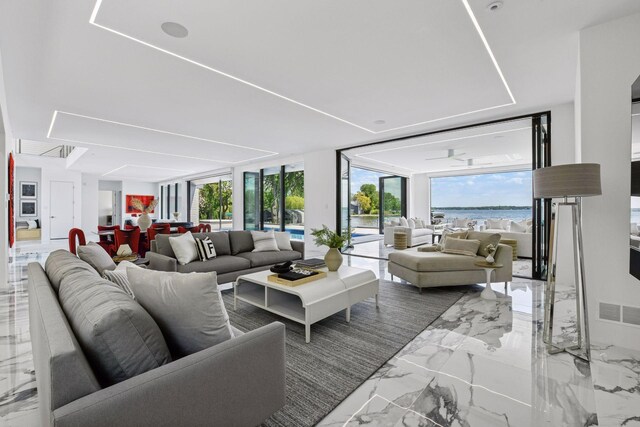 1225 Shoreline Dr, Orono, MN 55391 - living room featuring a water view, marble tiled floors, and expansive windows