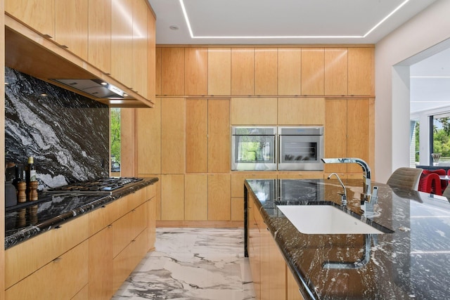 1225 Shoreline Dr, Orono, MN 55391 - kitchen with a sink, appliances with stainless steel finishes, light marble finish floors, dark stone counters, and modern cabinets