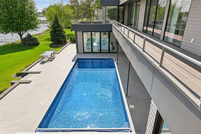 1225 Shoreline Dr, Orono, MN 55391 - outdoor pool with a patio area and a lawn