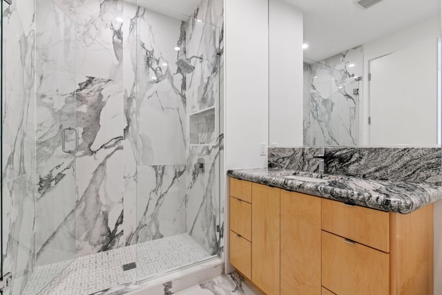 1225 Shoreline Dr, Orono, MN 55391 - full bathroom featuring marble finish floors, a marble finish shower, and vanity