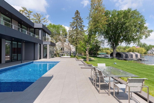 1225 Shoreline Dr, Orono, MN 55391 - swimming pool featuring a patio and a lawn
