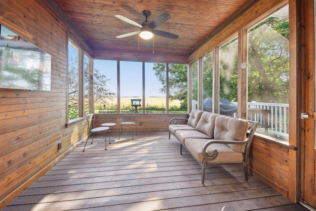 sunroom with wood ceiling and ceiling fan