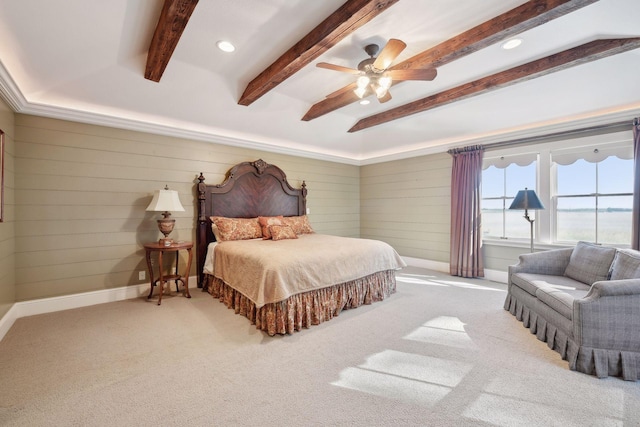 carpeted bedroom featuring wooden walls, ceiling fan, and beam ceiling