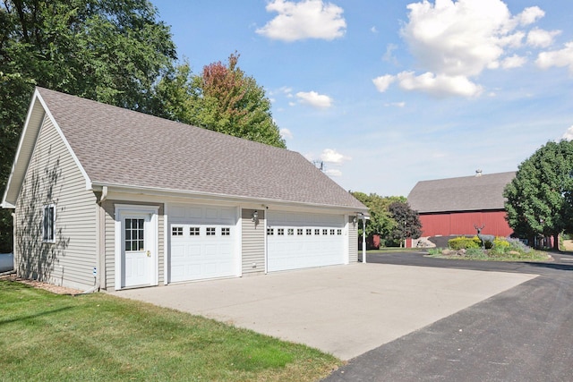 garage featuring a yard