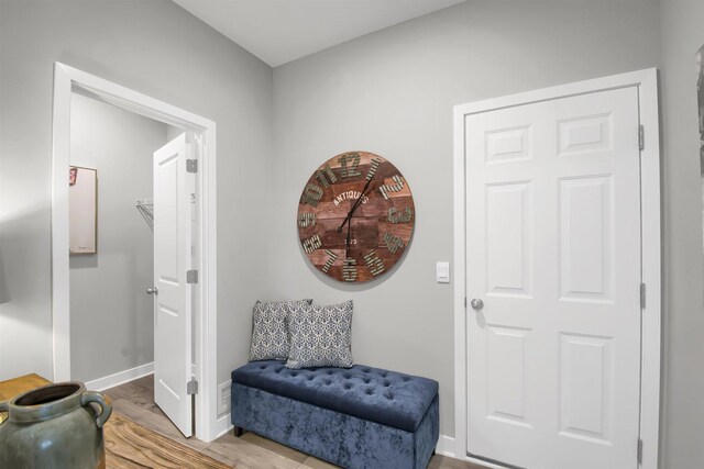 living area with light hardwood / wood-style floors