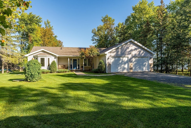 ranch-style house with a garage and a front yard