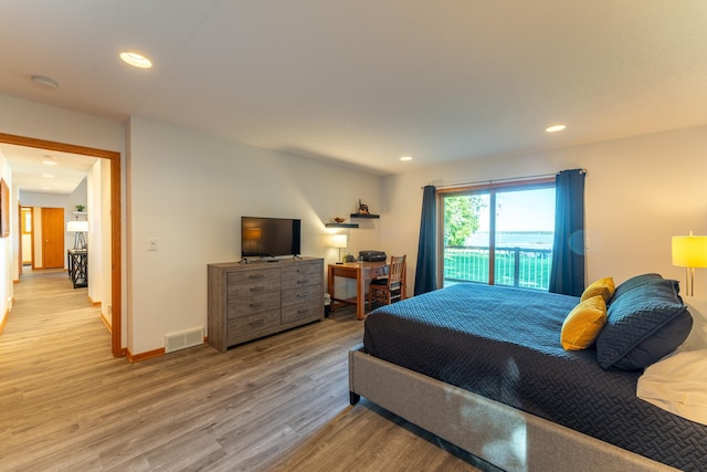 bedroom featuring access to outside and light wood-type flooring