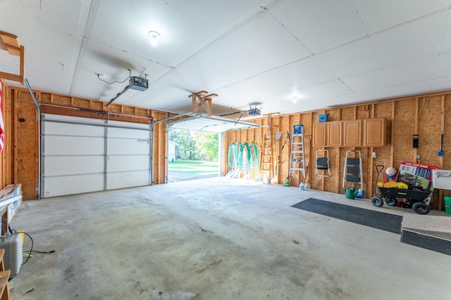 garage featuring a garage door opener