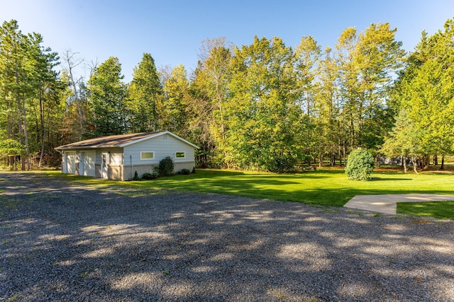 view of side of property with a yard