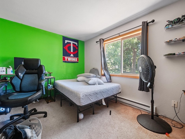 bedroom featuring carpet and a baseboard heating unit