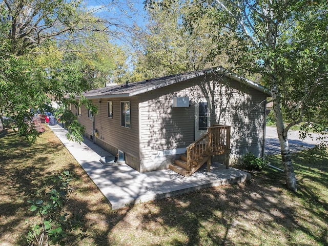 view of side of property featuring a yard