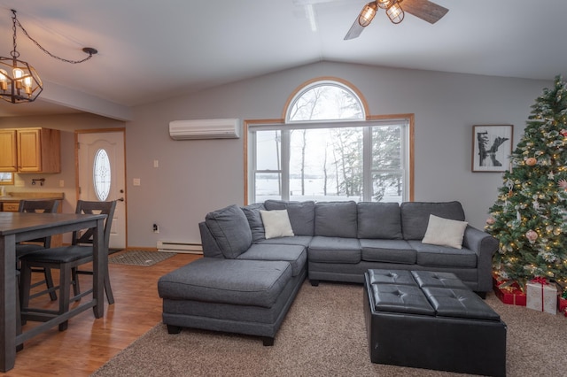 living room with lofted ceiling, a wall mounted AC, wood-type flooring, ceiling fan with notable chandelier, and a baseboard radiator