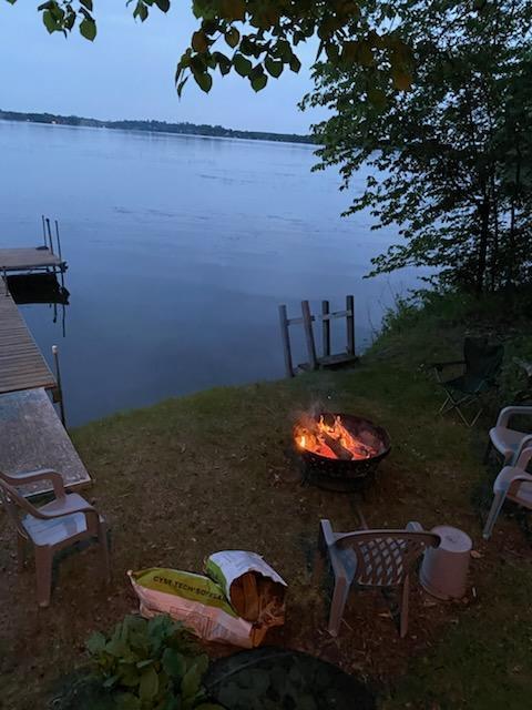 11421 Abby Ln NW, Alexandria, MN 56308 - dock area featuring an outdoor fire pit and a water view