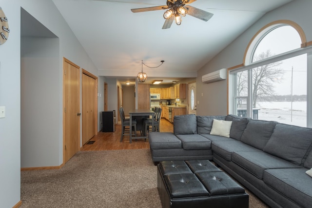 11421 Abby Ln NW, Alexandria, MN 56308 - living room with vaulted ceiling, light colored carpet, an AC wall unit, a ceiling fan, and baseboards