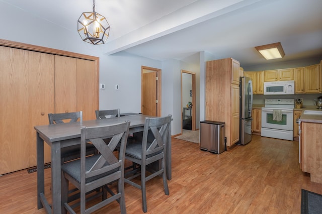 11421 Abby Ln NW, Alexandria, MN 56308 - dining room with light wood-type flooring and a chandelier