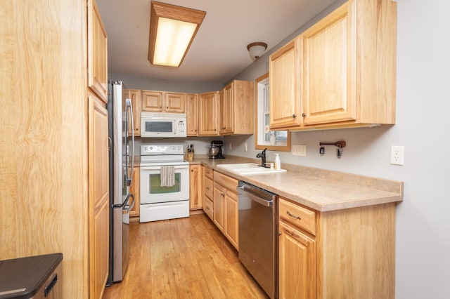 11421 Abby Ln NW, Alexandria, MN 56308 - kitchen with appliances with stainless steel finishes, a sink, light brown cabinets, light wood finished floors, and light countertops