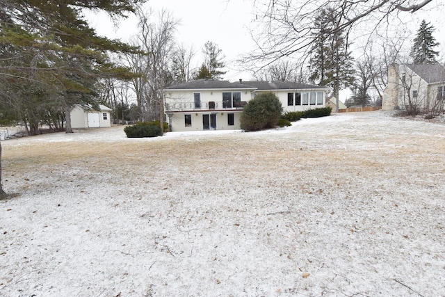 view of front of house featuring a shed and a deck