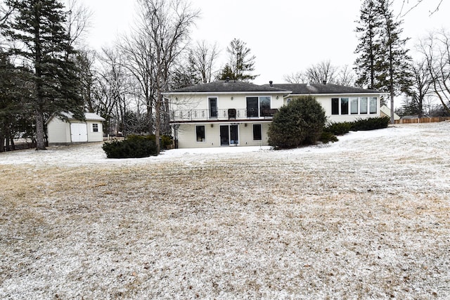 view of front of house with a wooden deck and a storage unit