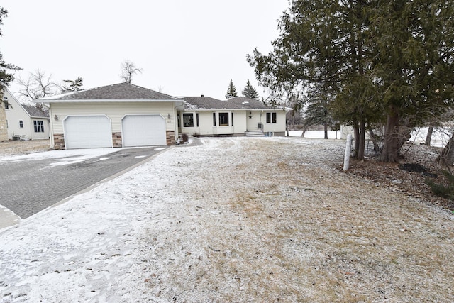 single story home featuring a garage