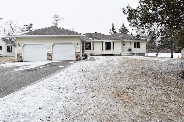 ranch-style house featuring a garage