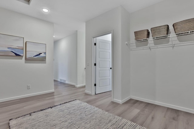 unfurnished bedroom with light wood-type flooring