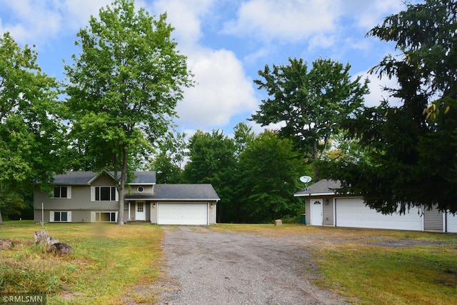 view of front of property featuring a garage and a front yard