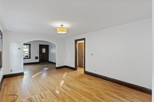 spare room featuring wood-type flooring