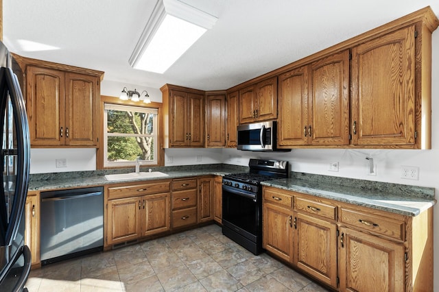 kitchen with sink and black appliances